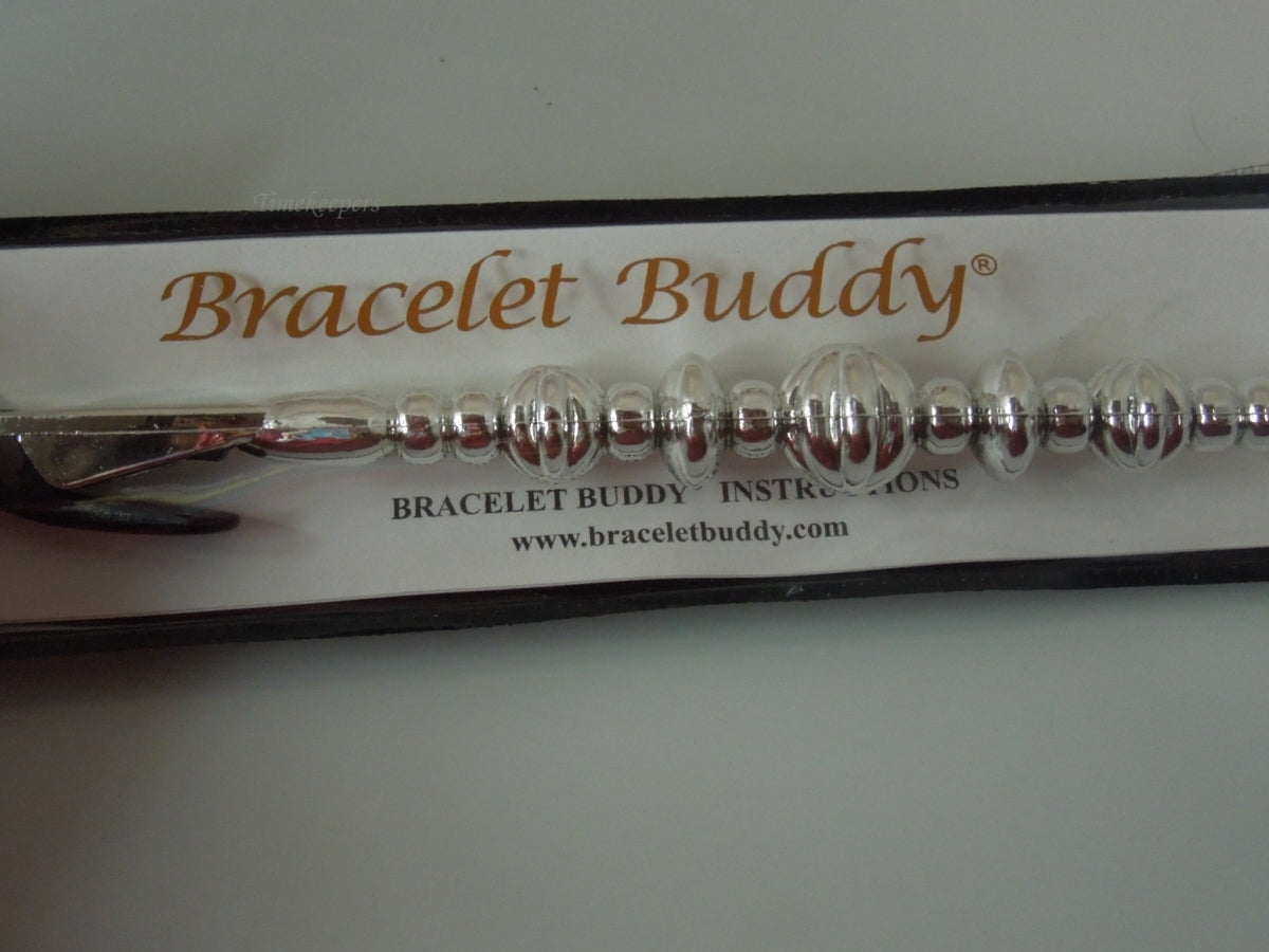 q393 Original Bracelet Buddy Brand New.(Silver Tone