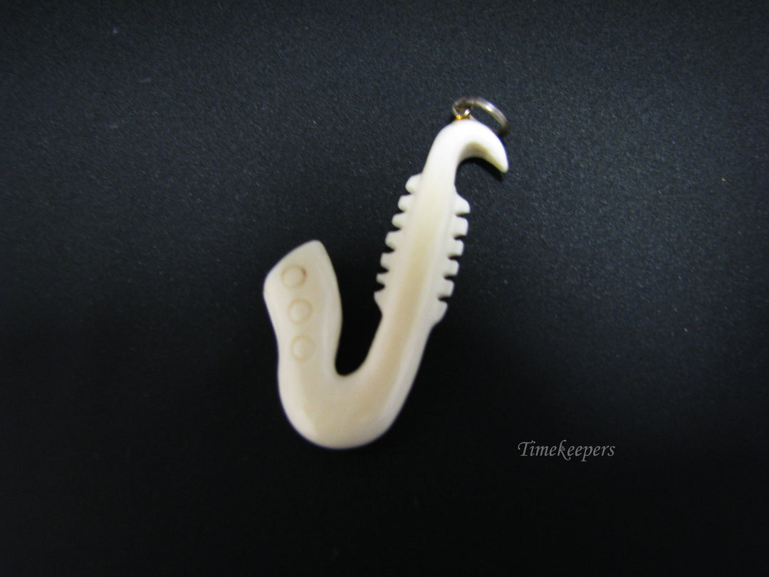 c673 Vintage Carved Bone Saxaphone Pendant/ Charm