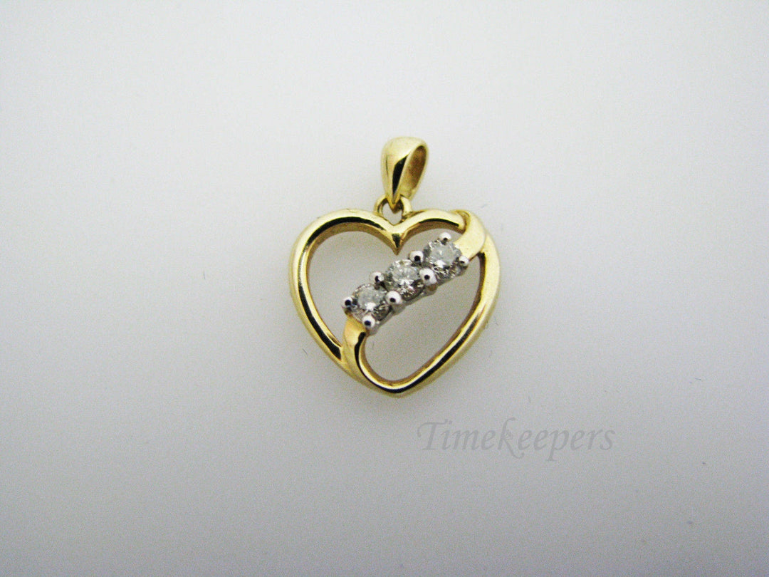c130 Beautiful 10k Gold Heart Pendant with a Ribbon of 3 Diamonds Across
