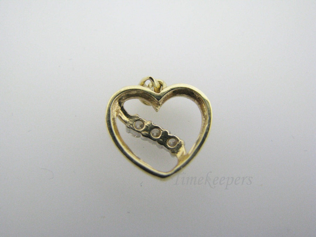 c130 Beautiful 10k Gold Heart Pendant with a Ribbon of 3 Diamonds Across
