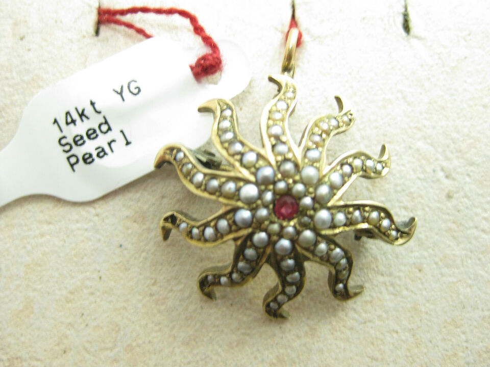 g264 beautiful 14kt Gold Starburst Brooch with Seed Pearls and a Center Ruby