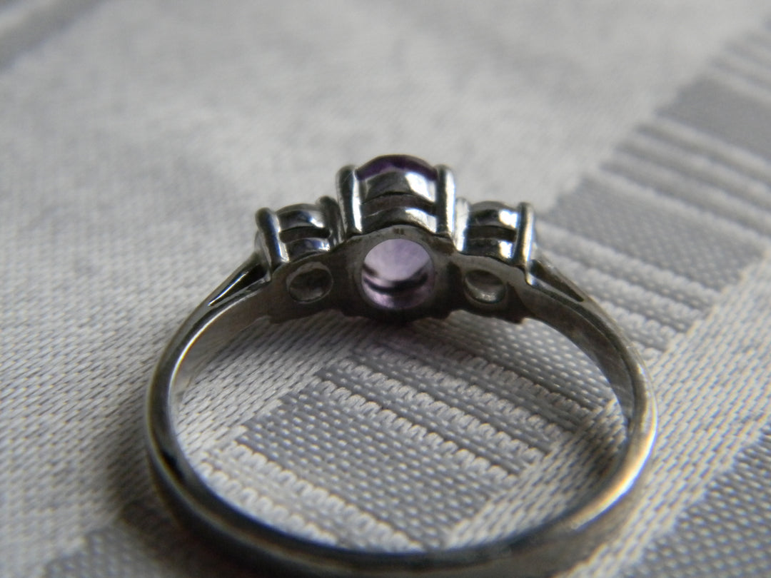 p410 Beautiful Sterling Silver Ring with Oval Purple Stone and CZ