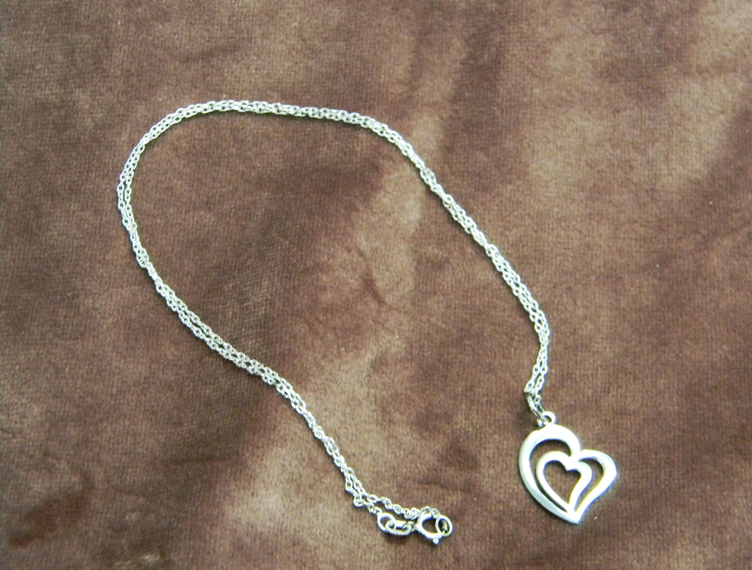 p412 Stunning Double heart Pendant on a Rolo Chain all in Sterling