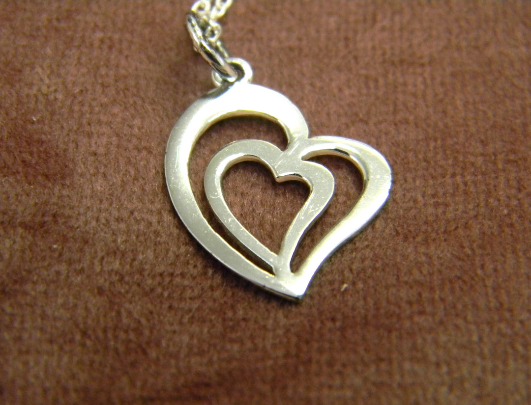 p412 Stunning Double heart Pendant on a Rolo Chain all in Sterling