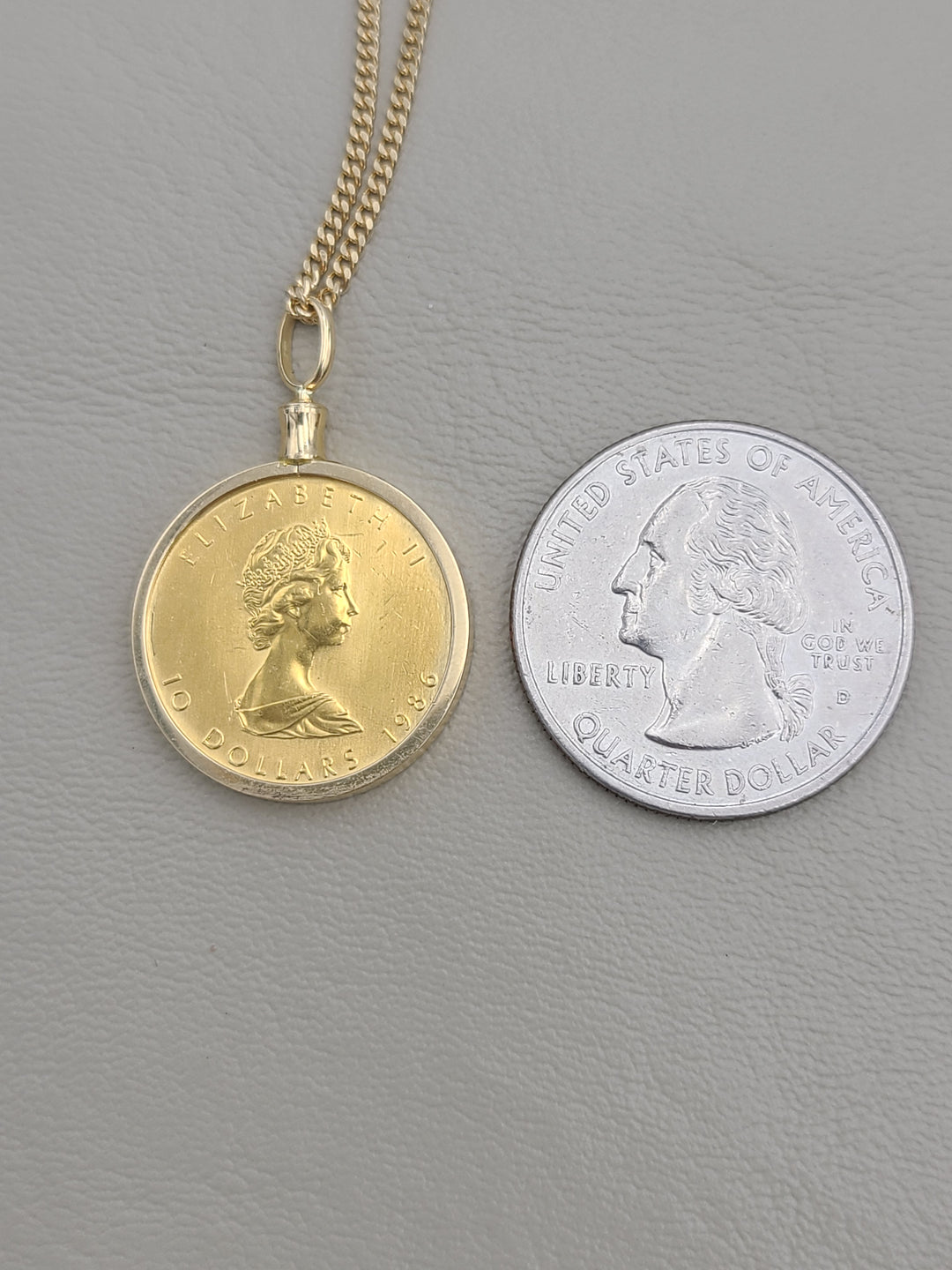 k835 Ladies 18kt Yellow Gold 16" Link Chain and 24kt 1986 Canadian Coin Pendant