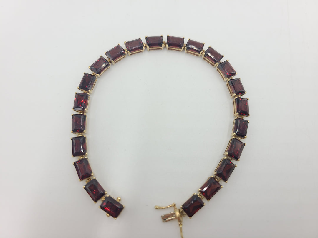 k775 Lovely Lady's 7 1/8" Garnet Bracelet in 14kt Yellow Gold