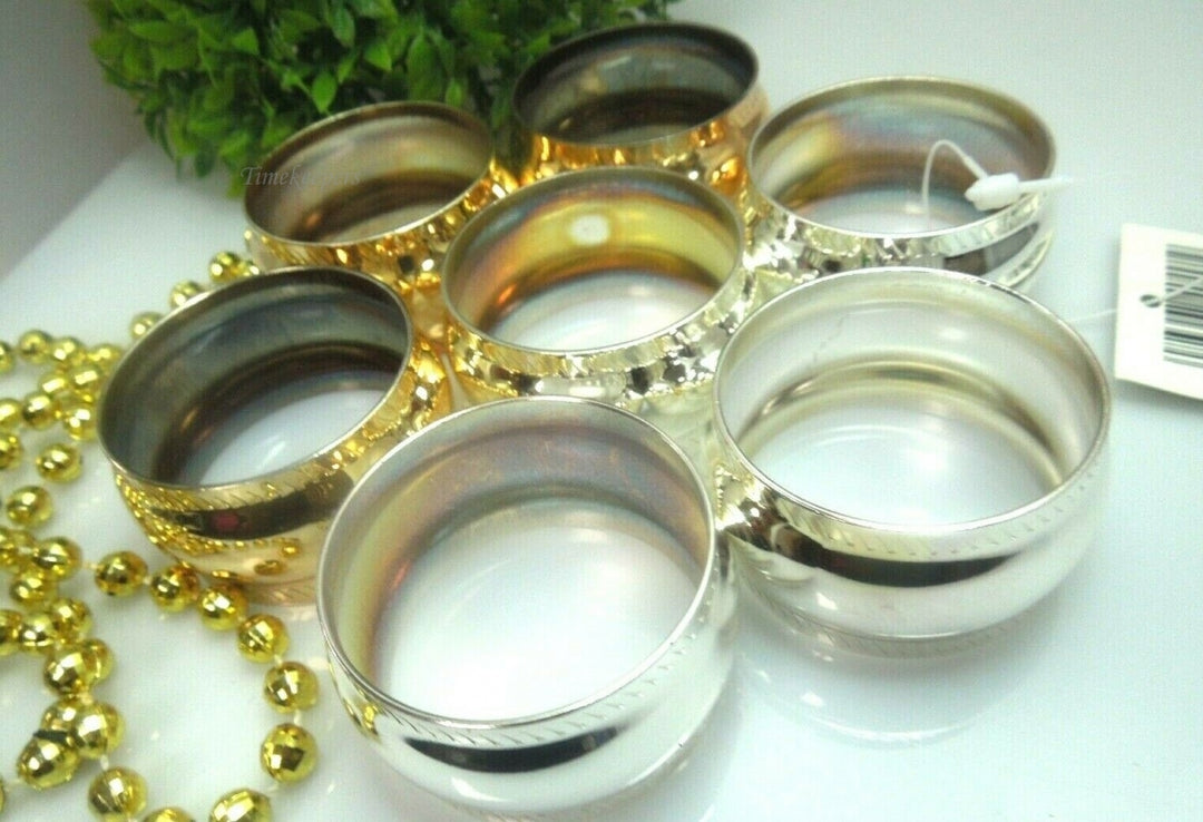 q528 Set of 7 Stainless Steel Napkin Holder Ring ( 4 Rings in Silver Tone and 3 Rings in Gold Tone)