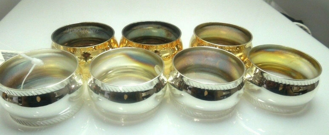 q528 Set of 7 Stainless Steel Napkin Holder Ring ( 4 Rings in Silver Tone and 3 Rings in Gold Tone)