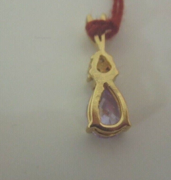 r935 10kt Yellow Gold Cubic Zirconia & Purple Stone Pendant 