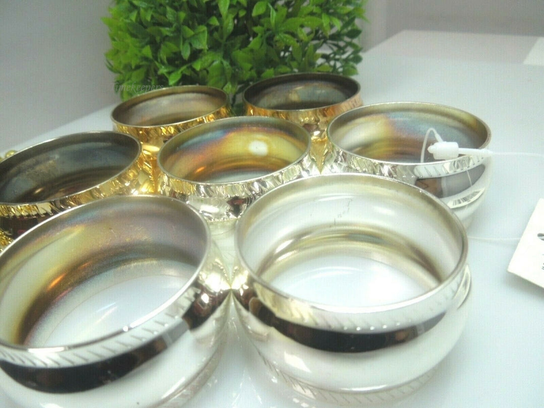 q528 Set of 7 Stainless Steel Napkin Holder Ring ( 4 Rings in Silver Tone and 3 Rings in Gold Tone)