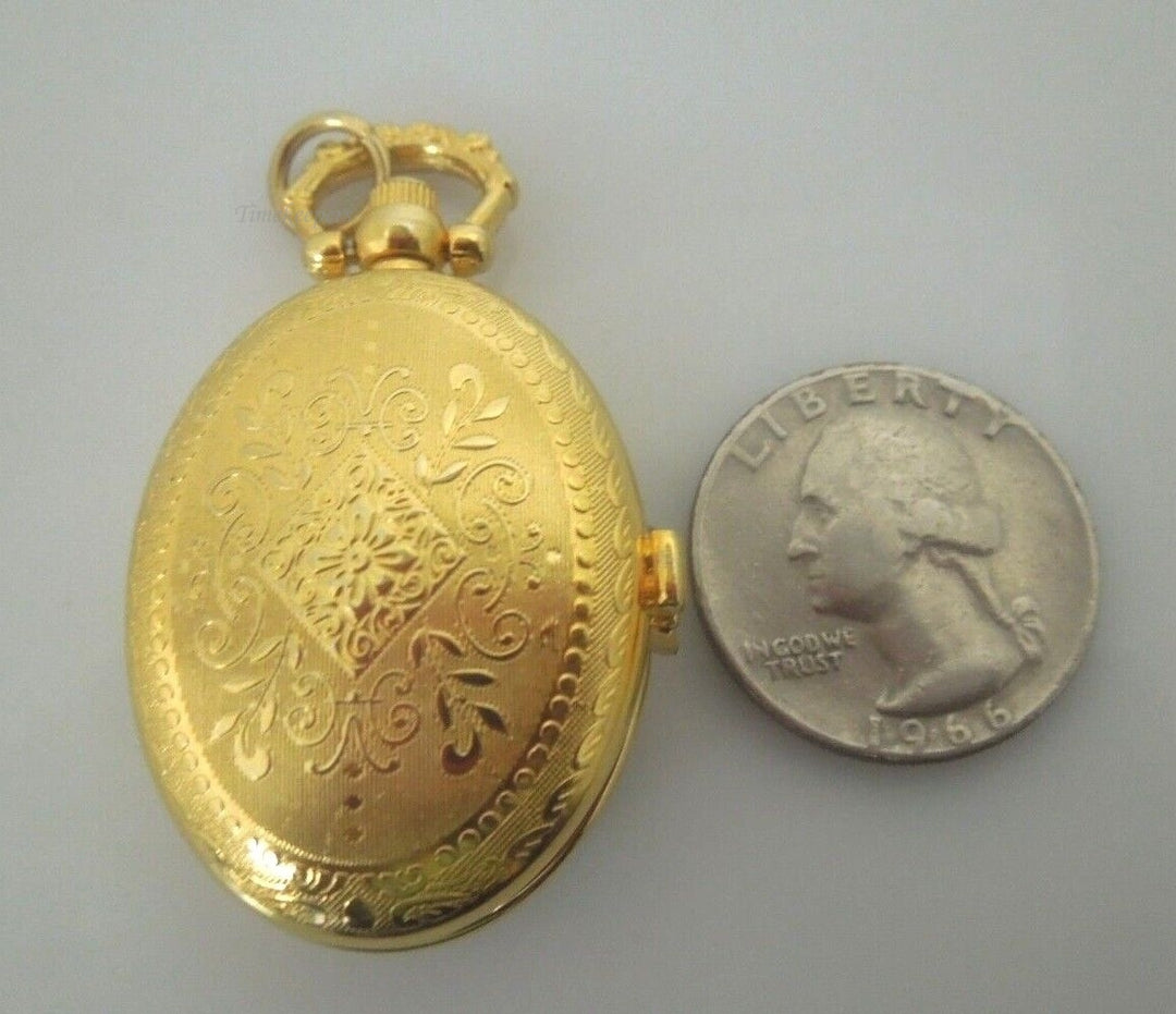 r867 Vintage Oval Etched Quartz Clock Gold tone Pendant Rare