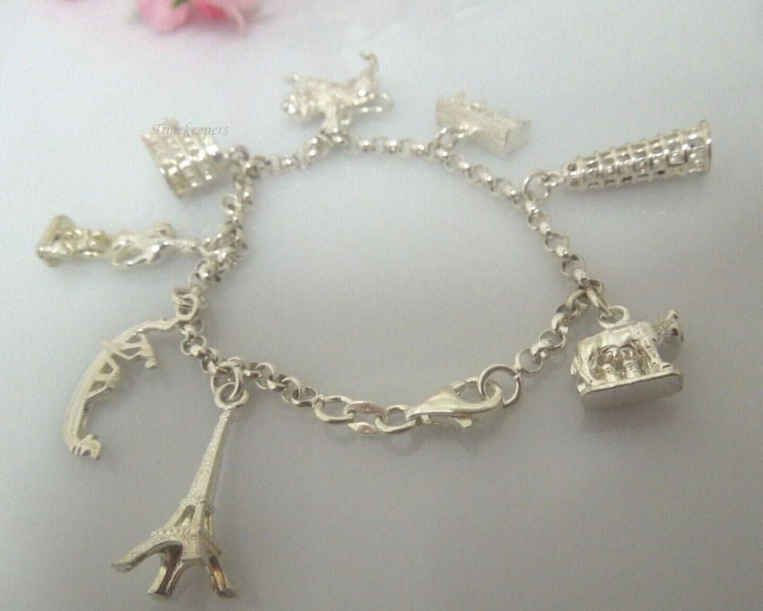 r799 Vintage Very Cute Sterling Silver Charm Bracelet 8 Charms Signed