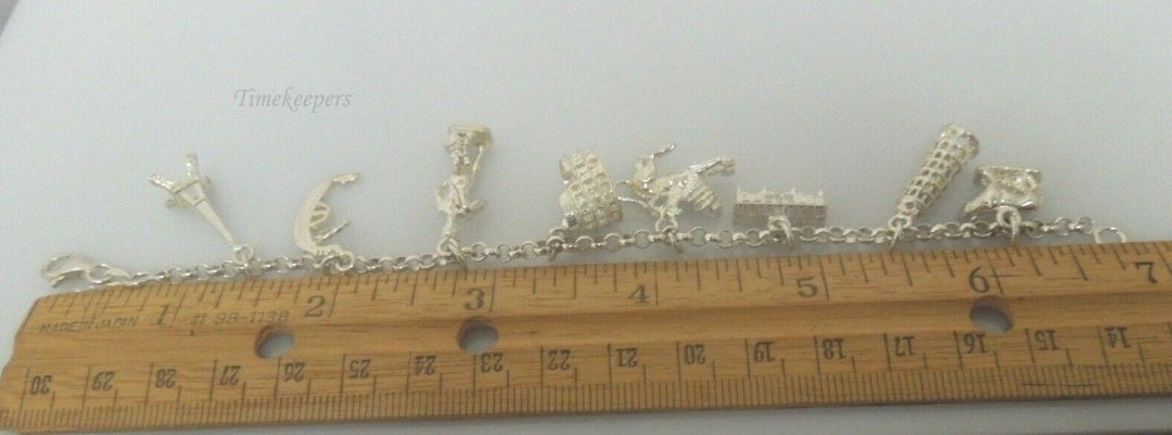 r799 Vintage Very Cute Sterling Silver Charm Bracelet 8 Charms Signed