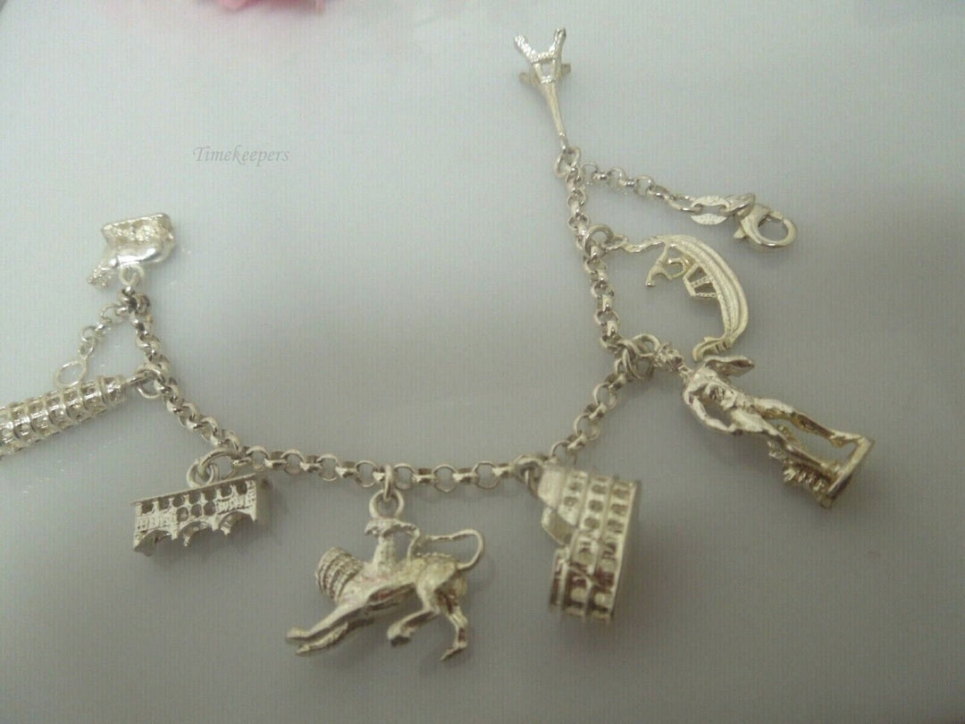 r799 Vintage Very Cute Sterling Silver Charm Bracelet 8 Charms Signed