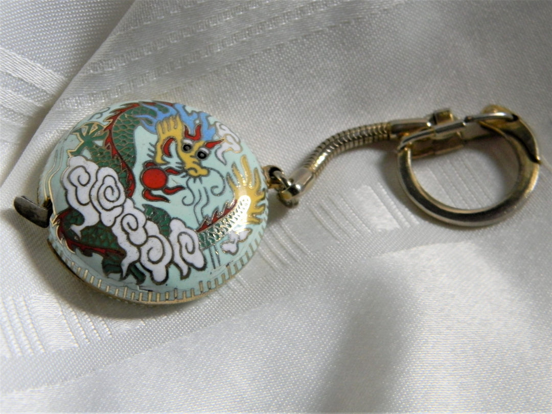 h654 Great Vintage Round Enamel Dragon Tape Measure on Gold Tone Key Chain