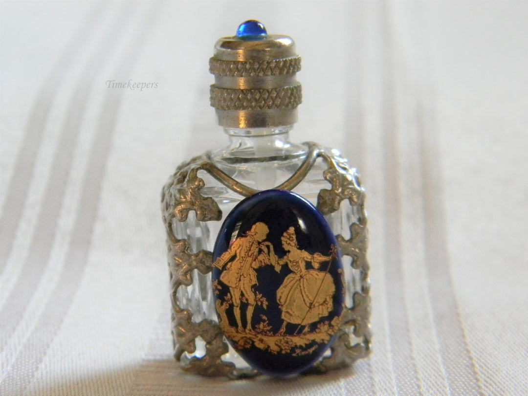 h668 Vintage Miniature Scent Bottle with Silver tone Filigree Case