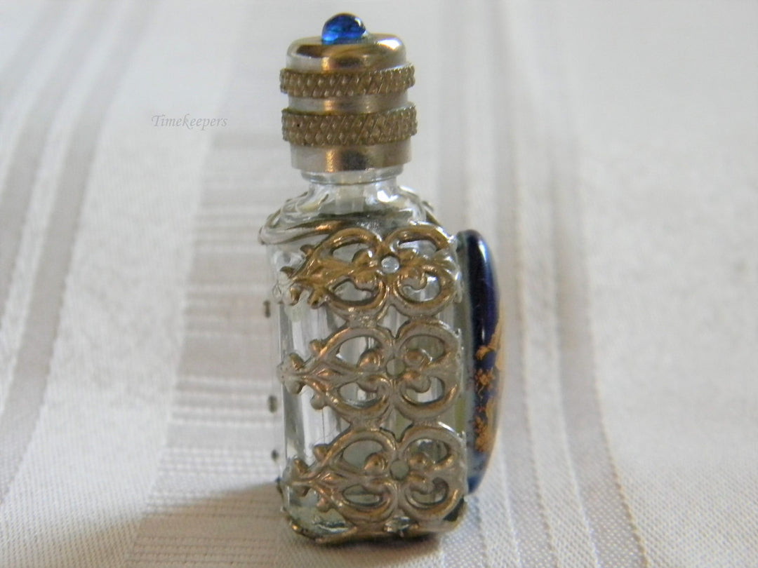 h668 Vintage Miniature Scent Bottle with Silver tone Filigree Case