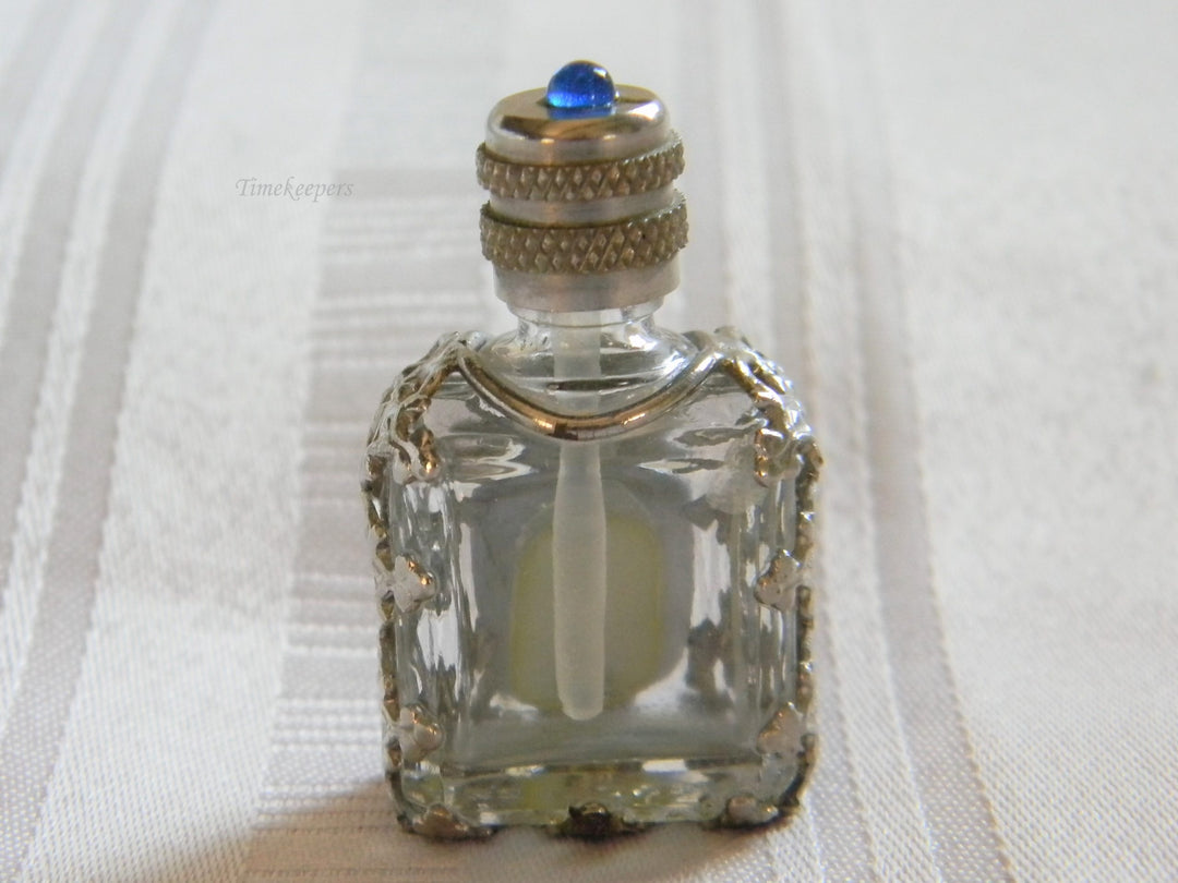 h668 Vintage Miniature Scent Bottle with Silver tone Filigree Case