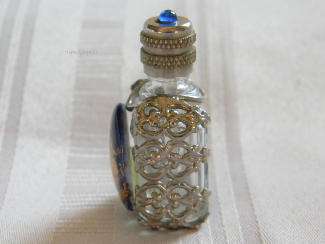 h668 Vintage Miniature Scent Bottle with Silver tone Filigree Case