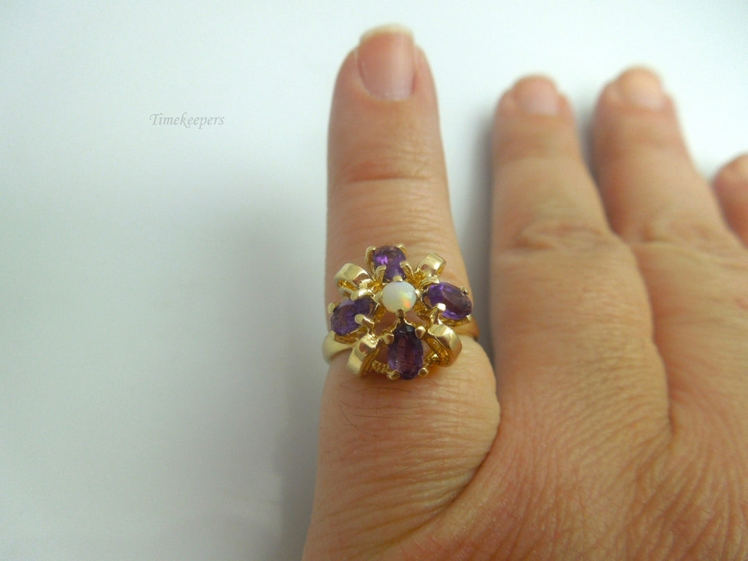 k609 Cute Ladies 14kt Yellow Gold Opal and Amethyst Bow Style Ring