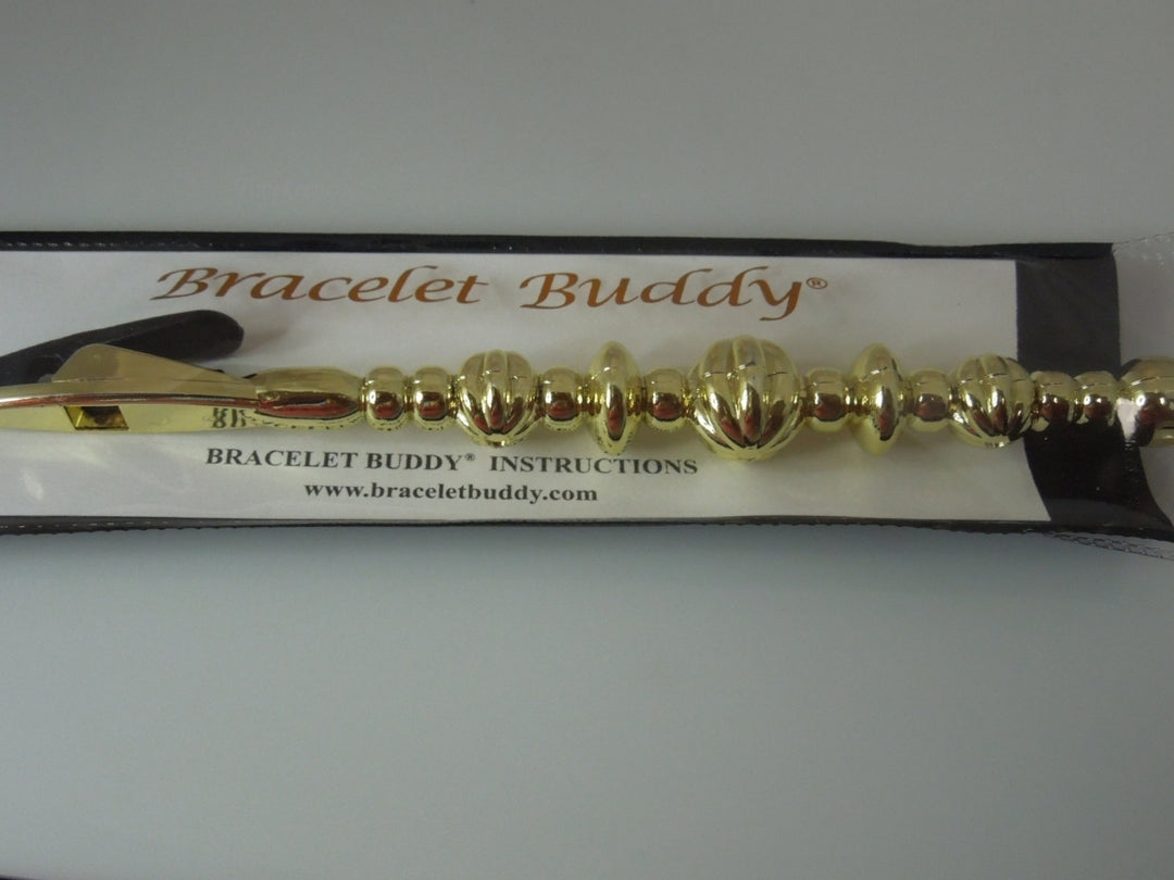 q392 Original Bracelet Buddy Brand New.(Gold Tone)