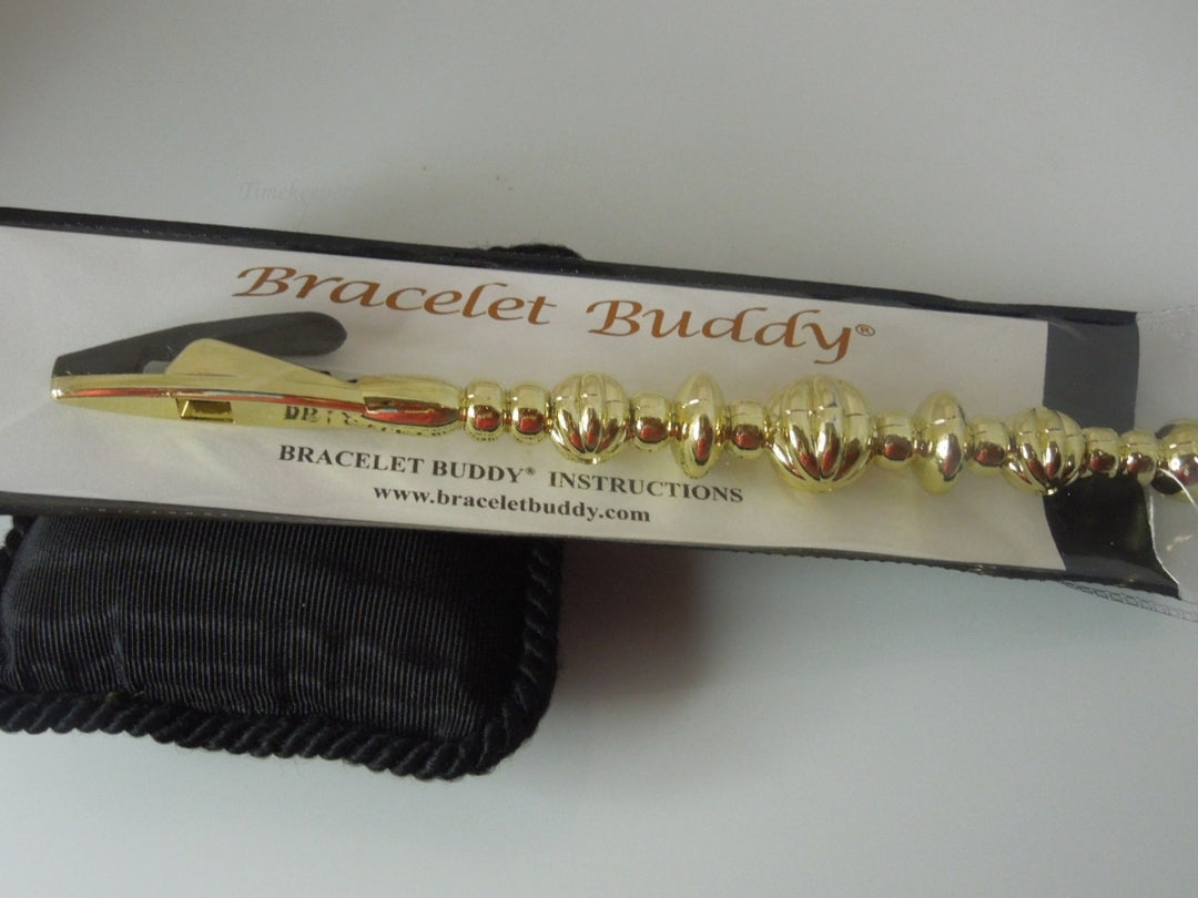 q392 Original Bracelet Buddy Brand New.(Gold Tone)