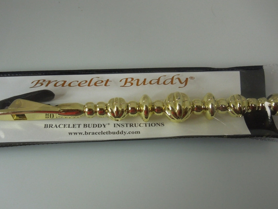 q392 Original Bracelet Buddy Brand New.(Gold Tone)