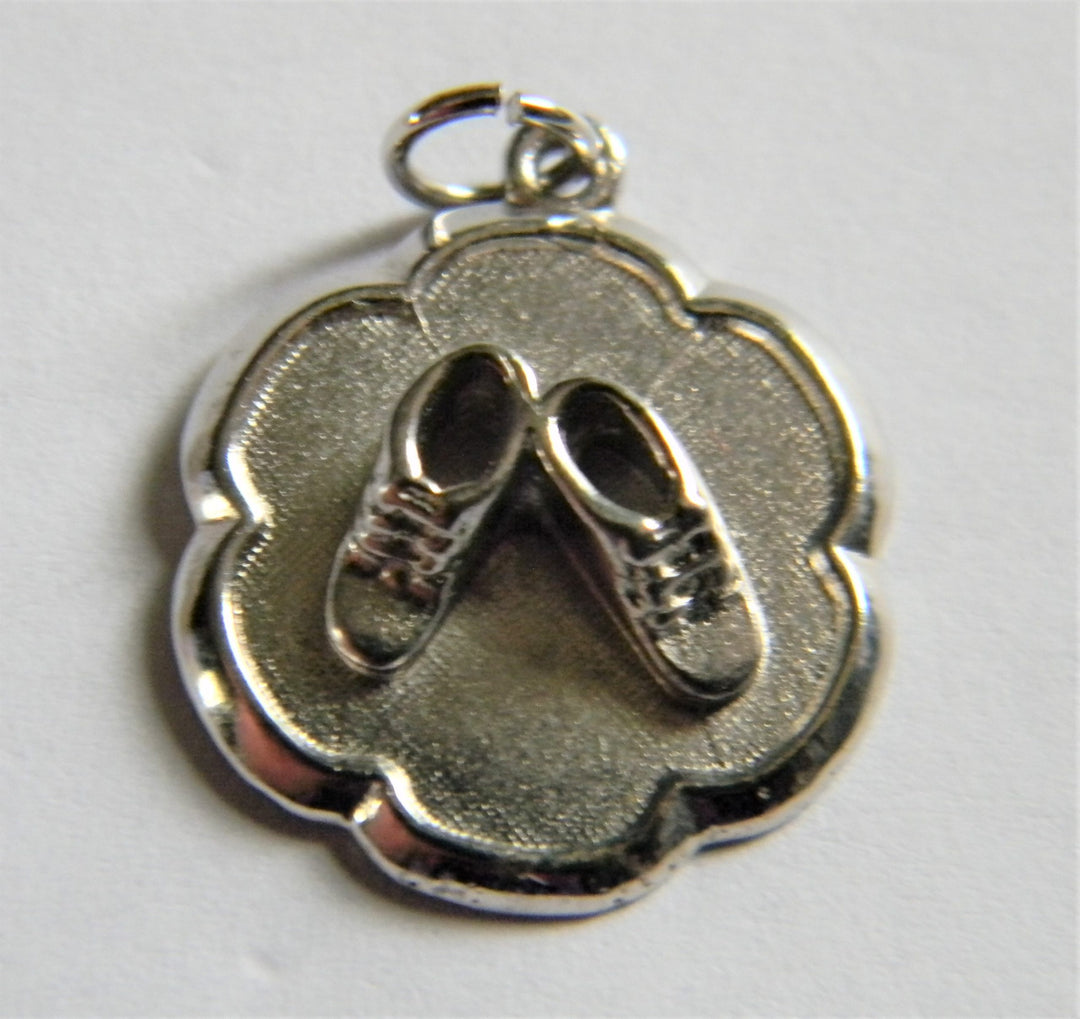 h814 Cute Sterling Silver Scalloped Edge Charm or Pendant with Baby Shoes