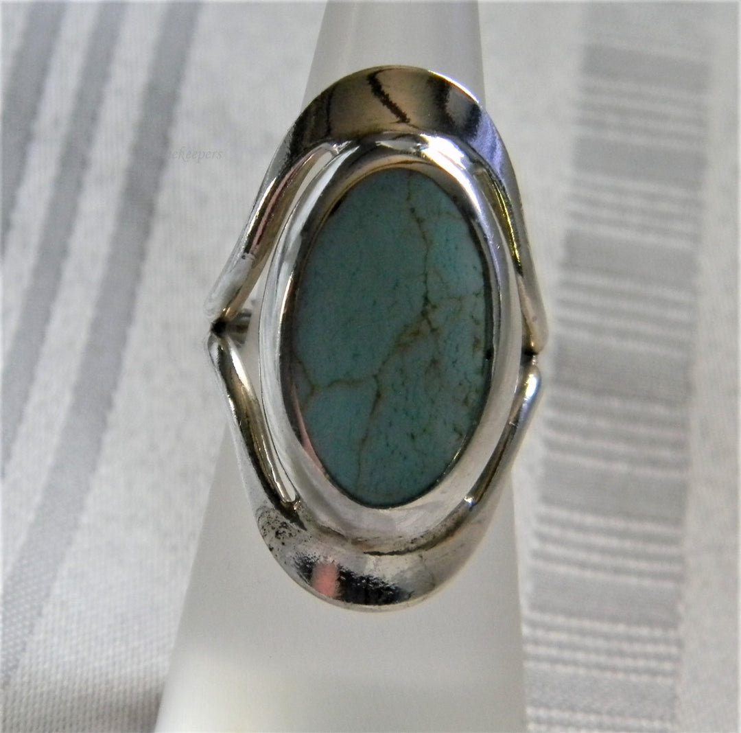 h954 Sterling Silver Ring with Bezel set Oval Turquoise in a Silver Frame