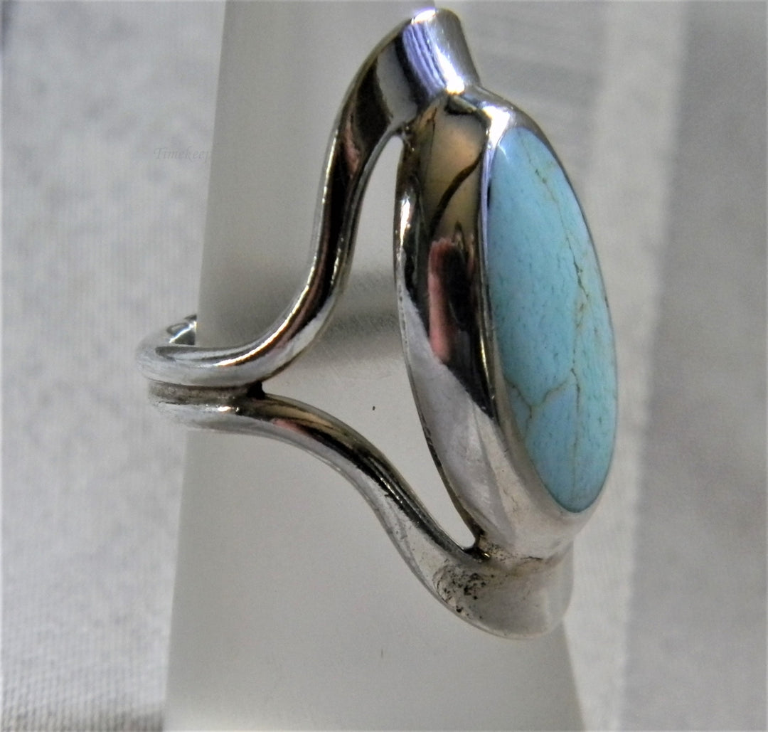 h954 Sterling Silver Ring with Bezel set Oval Turquoise in a Silver Frame