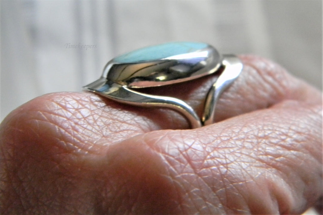 h954 Sterling Silver Ring with Bezel set Oval Turquoise in a Silver Frame