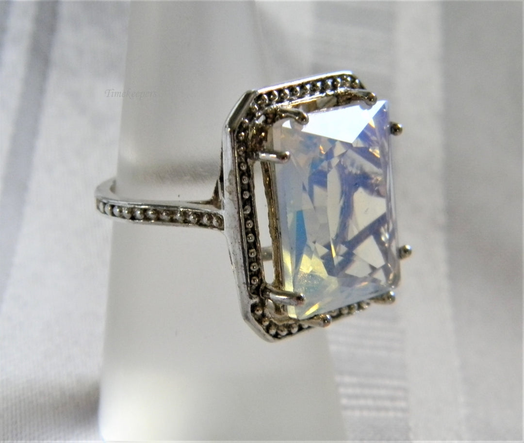 h955 Sterling Silver Ring with Iridescent Glass Stone in a Silver Frame