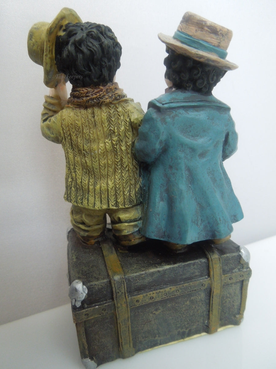 q741 Vintage Collectible Figurine Boy and Girl Standing on Trunk Suitcase