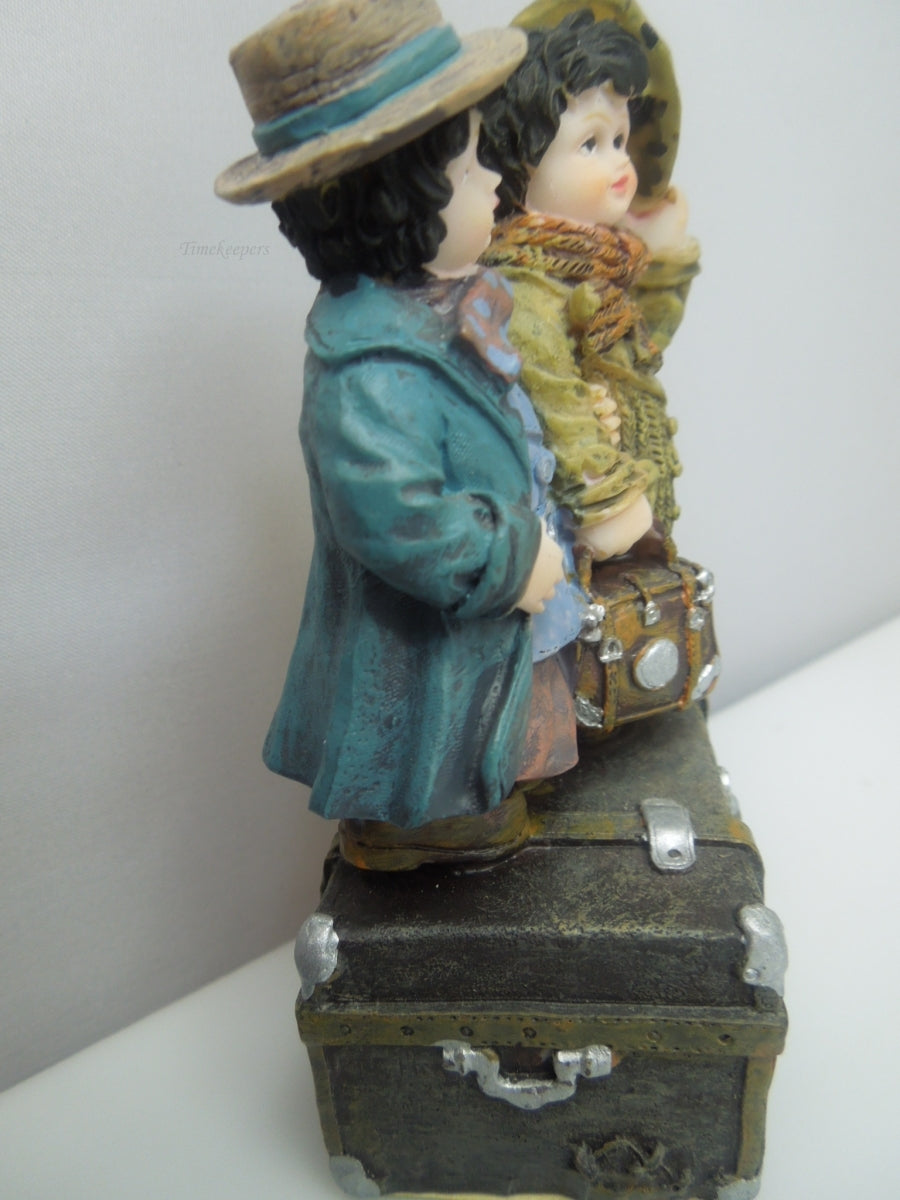 q741 Vintage Collectible Figurine Boy and Girl Standing on Trunk Suitcase