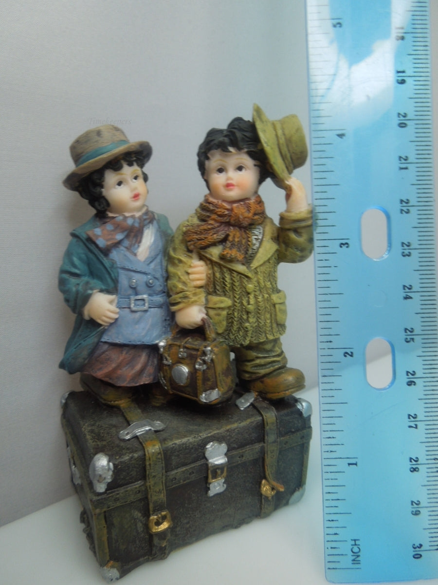 q741 Vintage Collectible Figurine Boy and Girl Standing on Trunk Suitcase