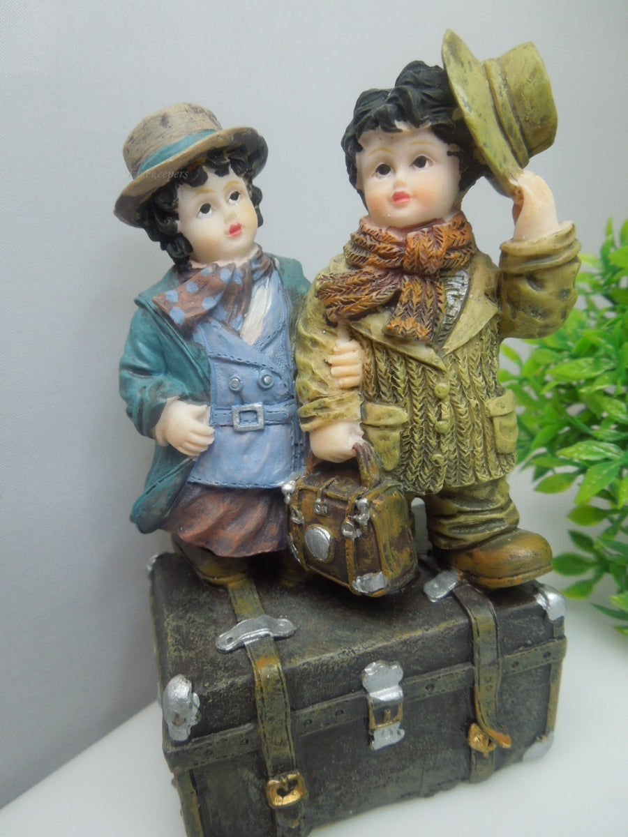 q741 Vintage Collectible Figurine Boy and Girl Standing on Trunk Suitcase