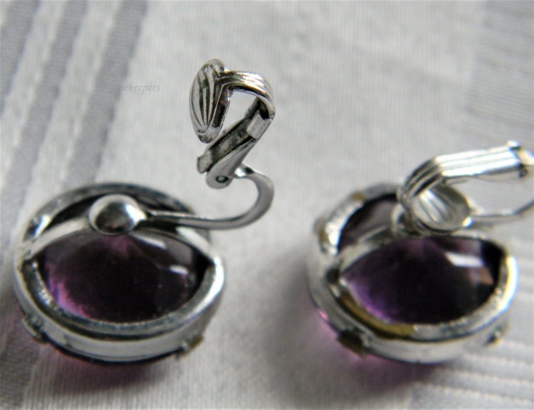 p107 Pretty Silver Tone Clip on Earrings with Faceted Purple Glass Stones