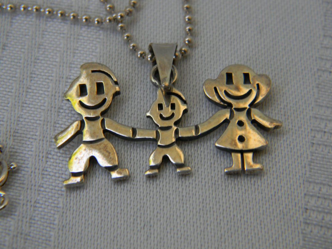 j335 Cute Mom, Dad, and Child Pendant in Sterling Silver