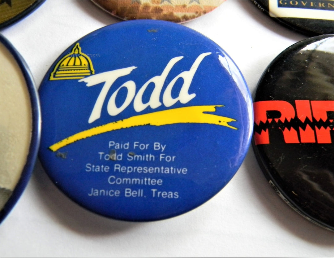 Lot - POLITICAL CAMPAIGN PIN-BACKS Housed in a three-ring binder
