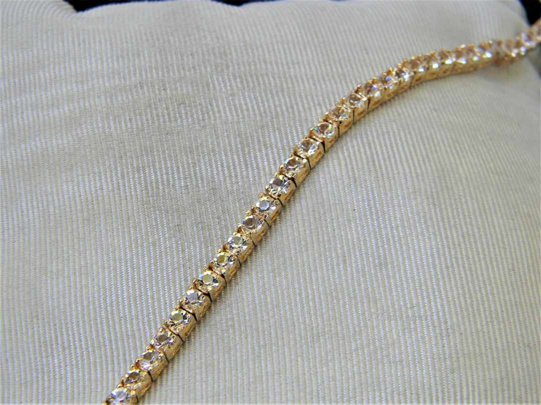 j356 Lovely Gold Tone Tennis Bracelet with Clear Stones