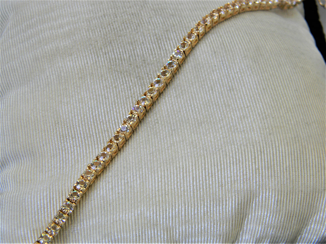 j356 Lovely Gold Tone Tennis Bracelet with Clear Stones