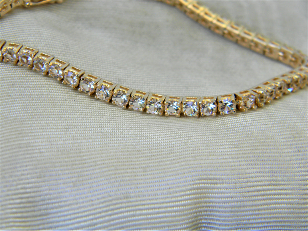 j356 Lovely Gold Tone Tennis Bracelet with Clear Stones