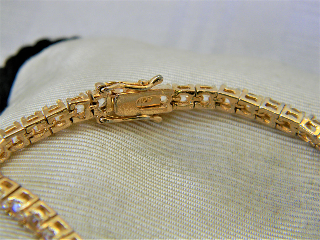 j356 Lovely Gold Tone Tennis Bracelet with Clear Stones