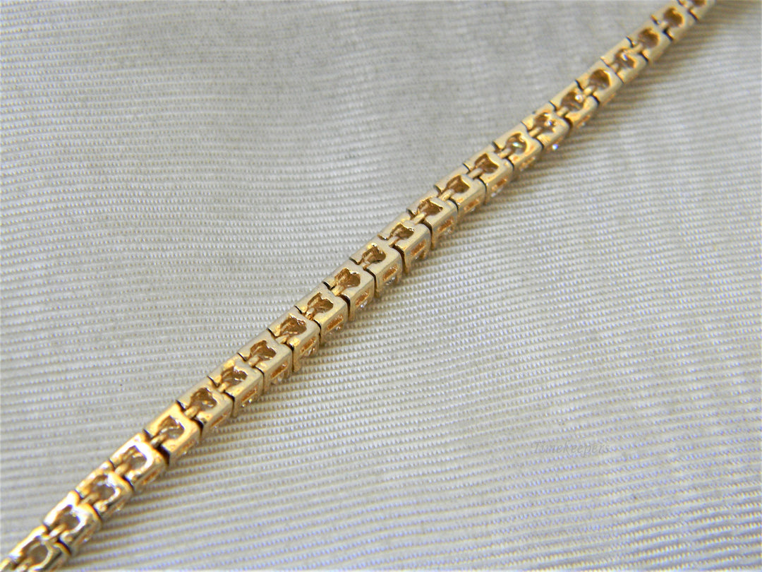 j356 Lovely Gold Tone Tennis Bracelet with Clear Stones