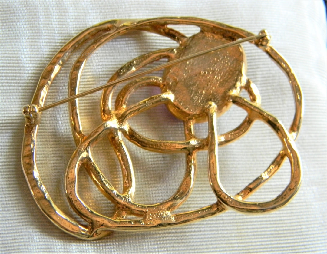 p327 Unique Swirl Design Gold Tone Brooch with Purple Stone by Avon