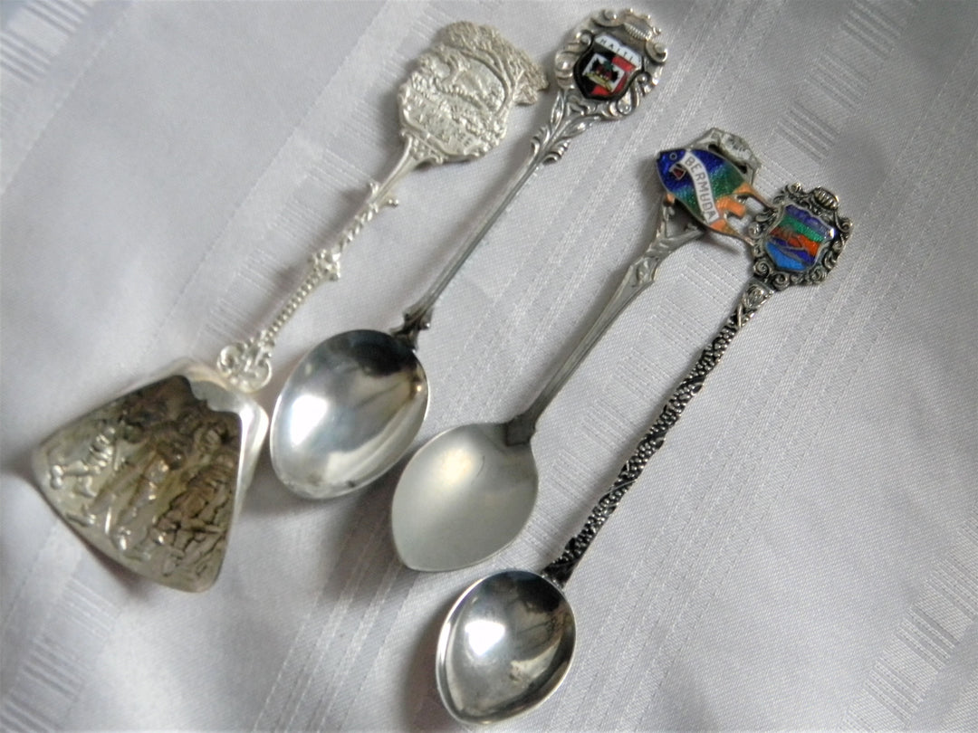 h615 Set of 4 Collectible Spoons Aruba, Haiti, Bermuda, Rio de Janeiro