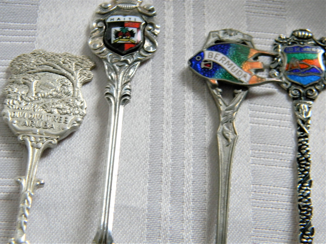 h615 Set of 4 Collectible Spoons Aruba, Haiti, Bermuda, Rio de Janeiro