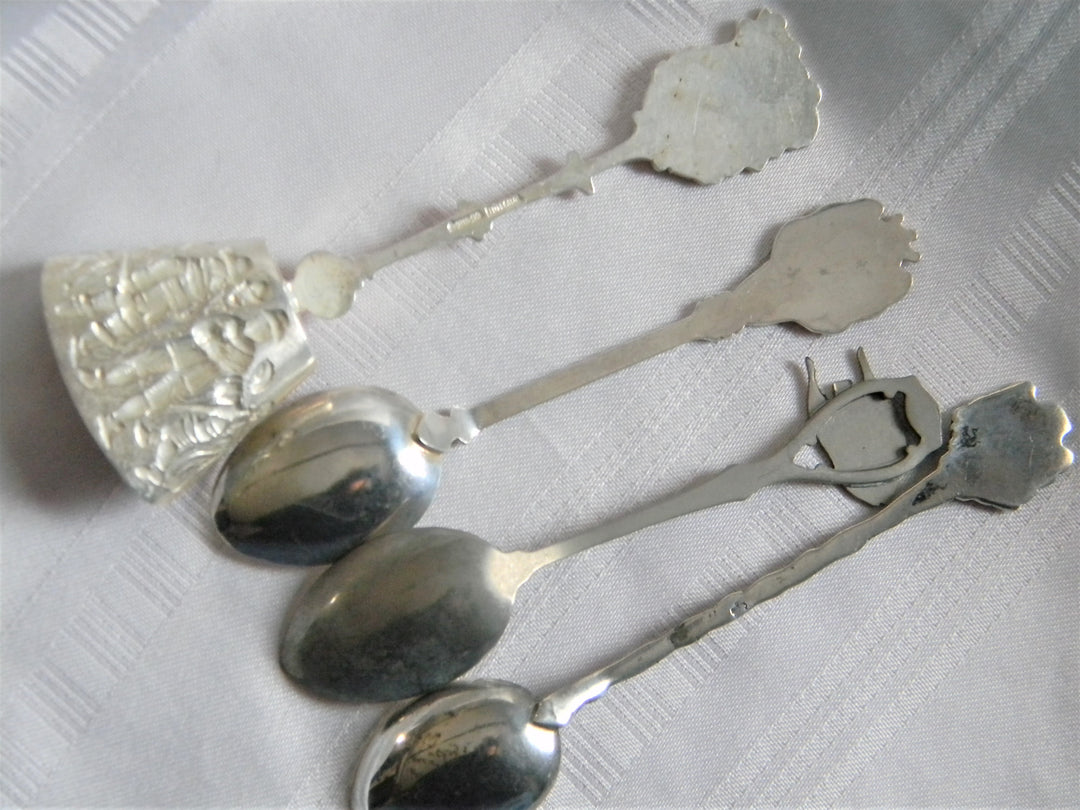 h615 Set of 4 Collectible Spoons Aruba, Haiti, Bermuda, Rio de Janeiro