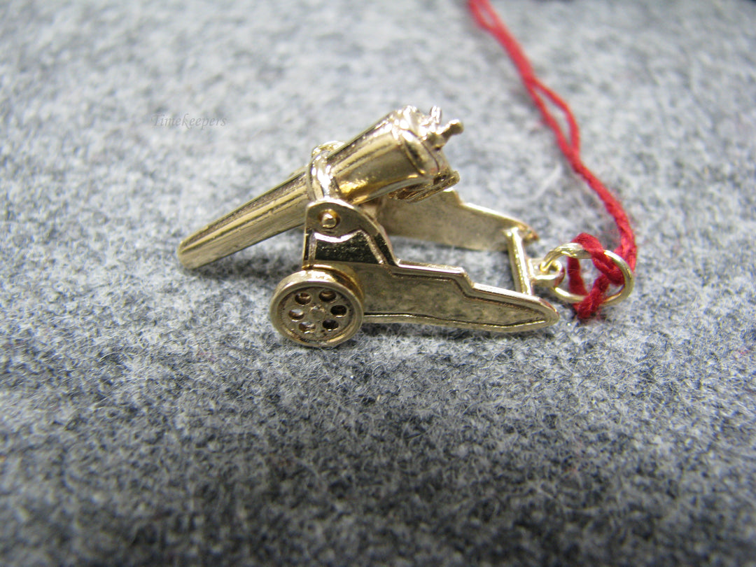 b242 Neat 14kt Cannon pendant