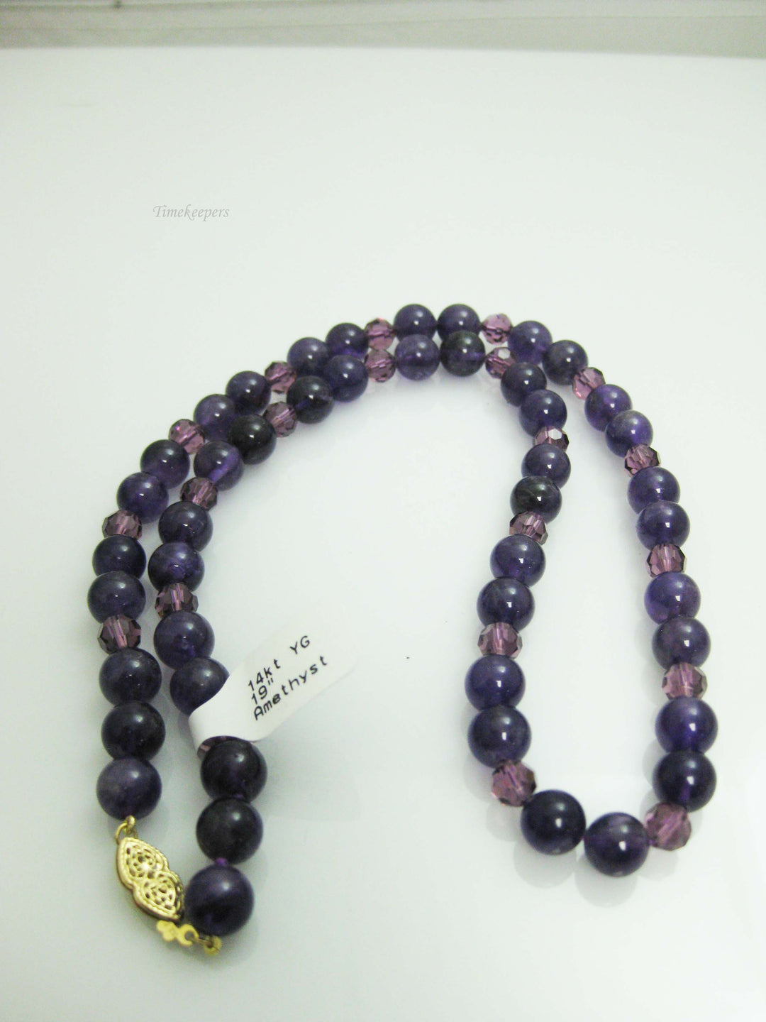 c037 Gorgeous Strand of Purple Beads with a Removable Heart Shaped Amethyst in 14k